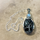 Detailed view of the Lunar Reflections Tree of Life Necklace showing the intricate silver tree branches and moonstone detail with sterling silver chain