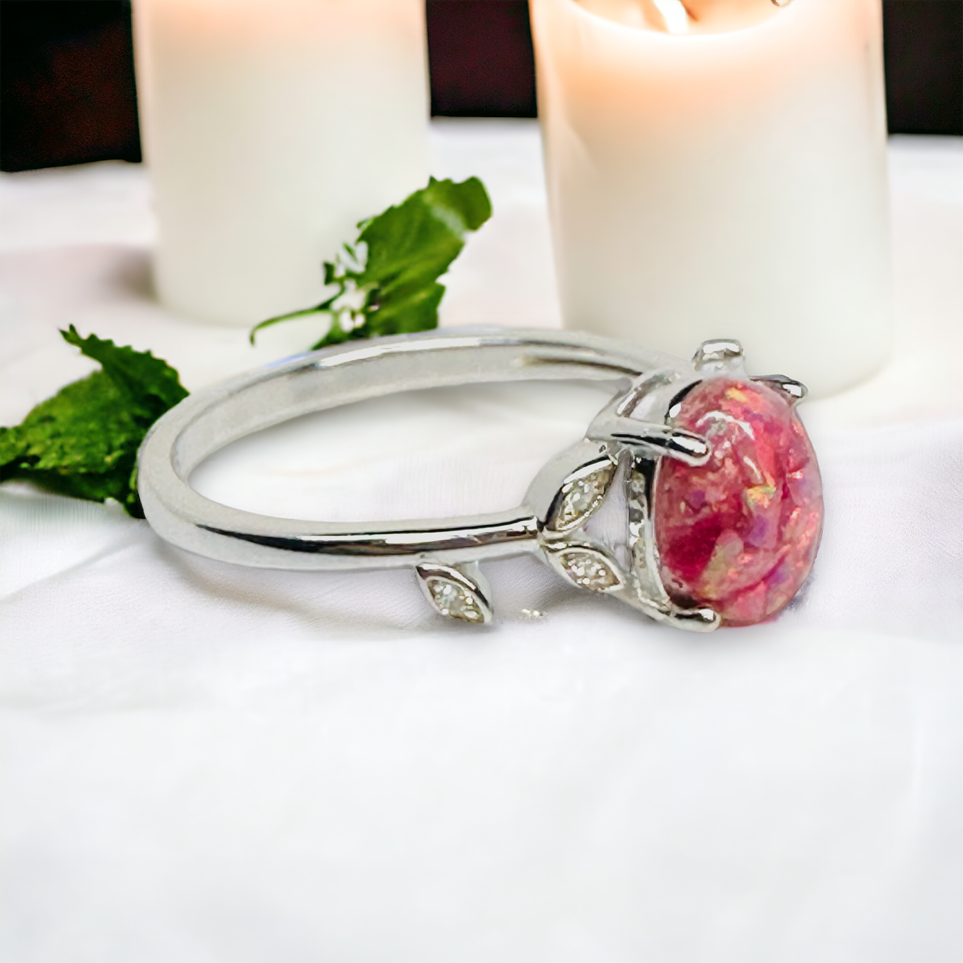 Side view of the Flora Petite Floral Ring in Silver, highlighting the Aurora crushed opal cremation stone and intricate cz leaf design, reflecting a connection to nature and the cycle of life.