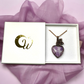 Purple Larvikite Heart Necklace in Floral Copper Setting shown in white gift box with golden logo