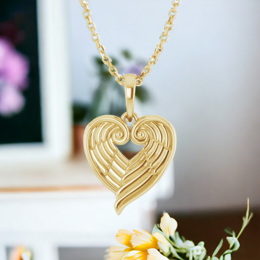 Front view of Eternal Embrace Angel Wing Heart necklace in 14k Yellow Gold with detailed heart and wings design, on a matching chain.