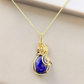 Close-up of the Royal Blue Lapis Lazuli Teardrop Necklace showcasing its vibrant blue color and intricate 14k gold filled wire wrapping.