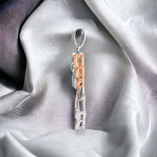 Side view of Guardian Angel Diamond Pendant showing the two-tone detail in sterling silver and 14K rose gold vermeil.