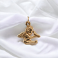 14K yellow gold pendant showcasing a detailed cherub holding a dove, symbolizing peace and spiritual protection.