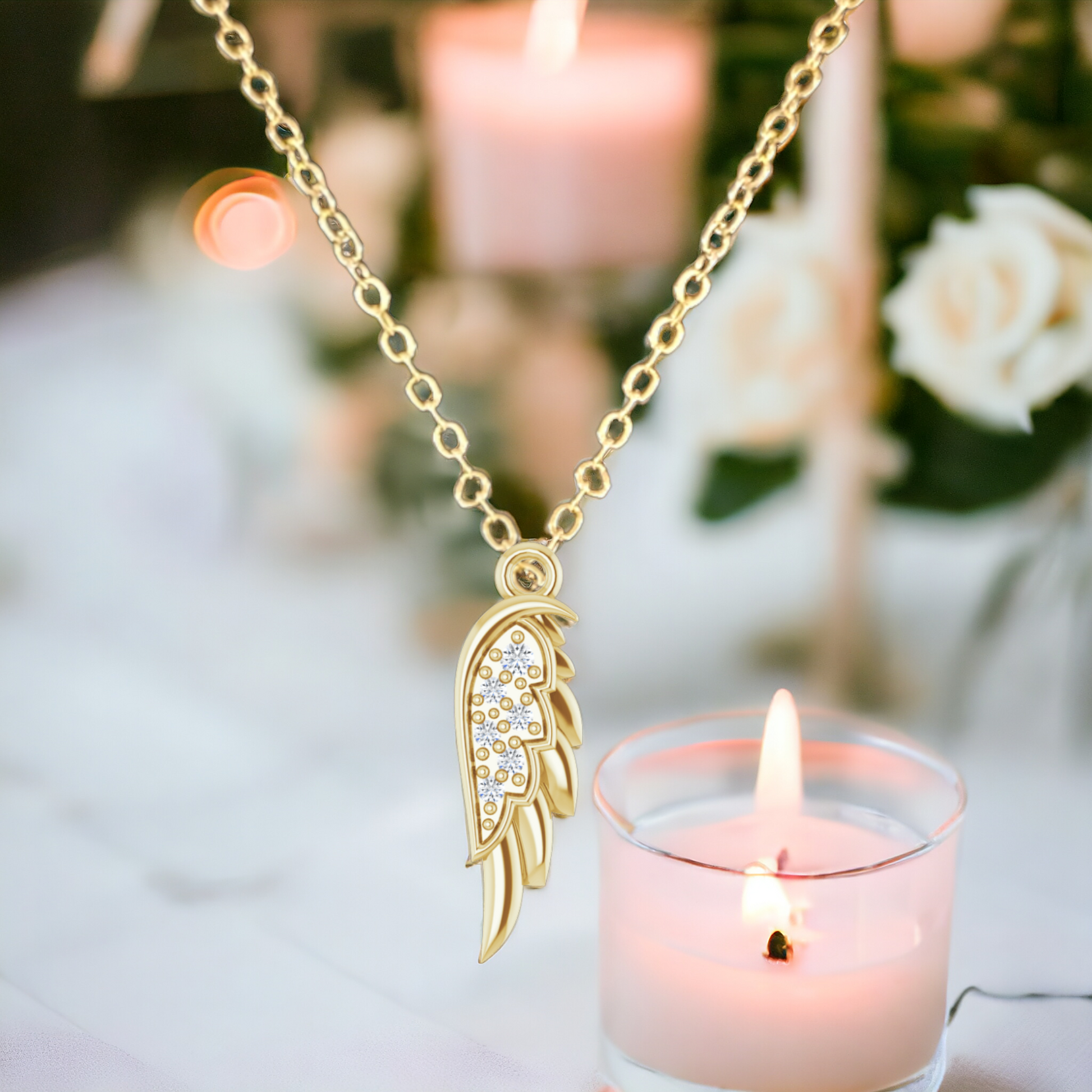 14K yellow gold angel wing pendant on optional gold chain.