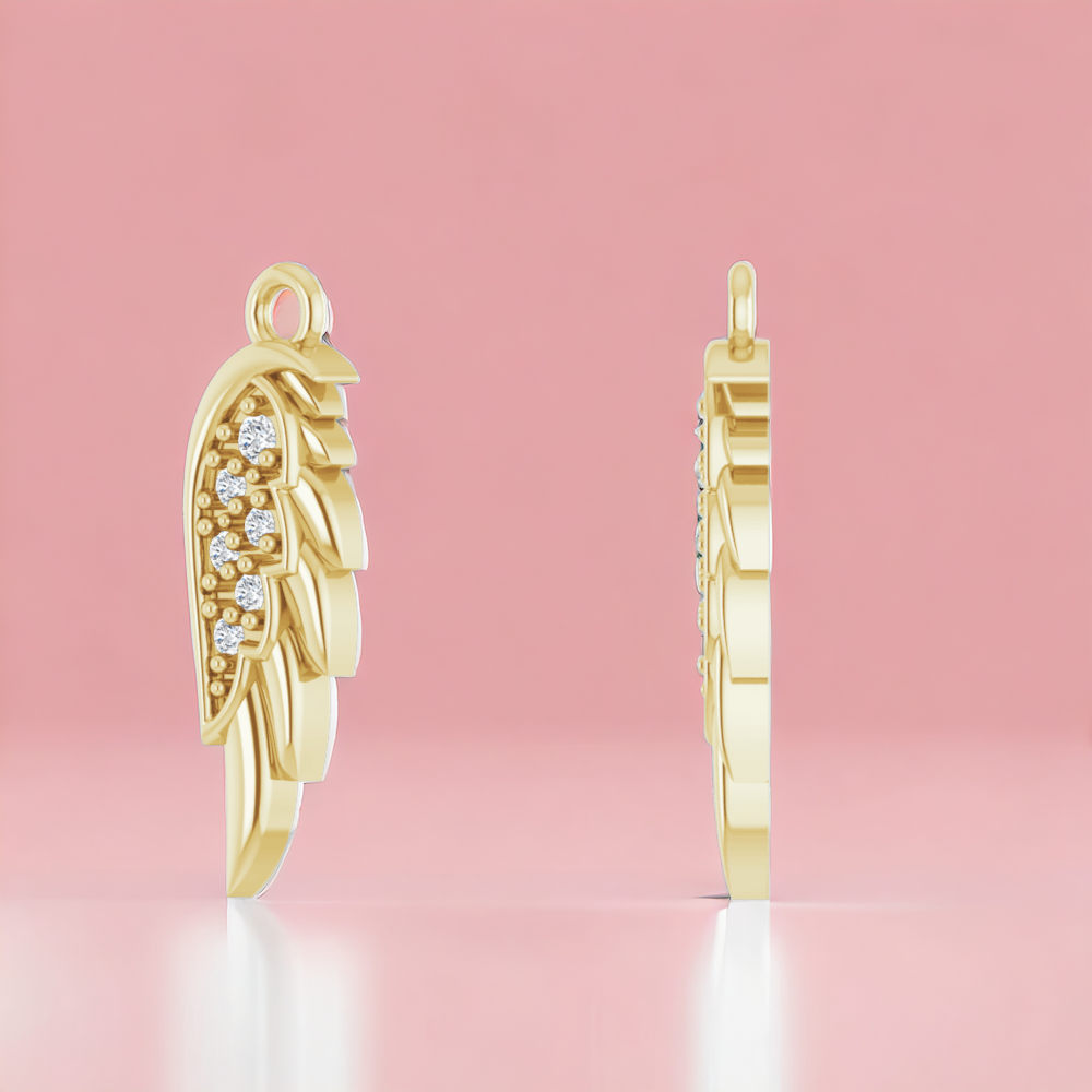 Side view of a 14k yellow gold angel wing pendant with diamonds, showcasing the fine detail and craft on a pink background.