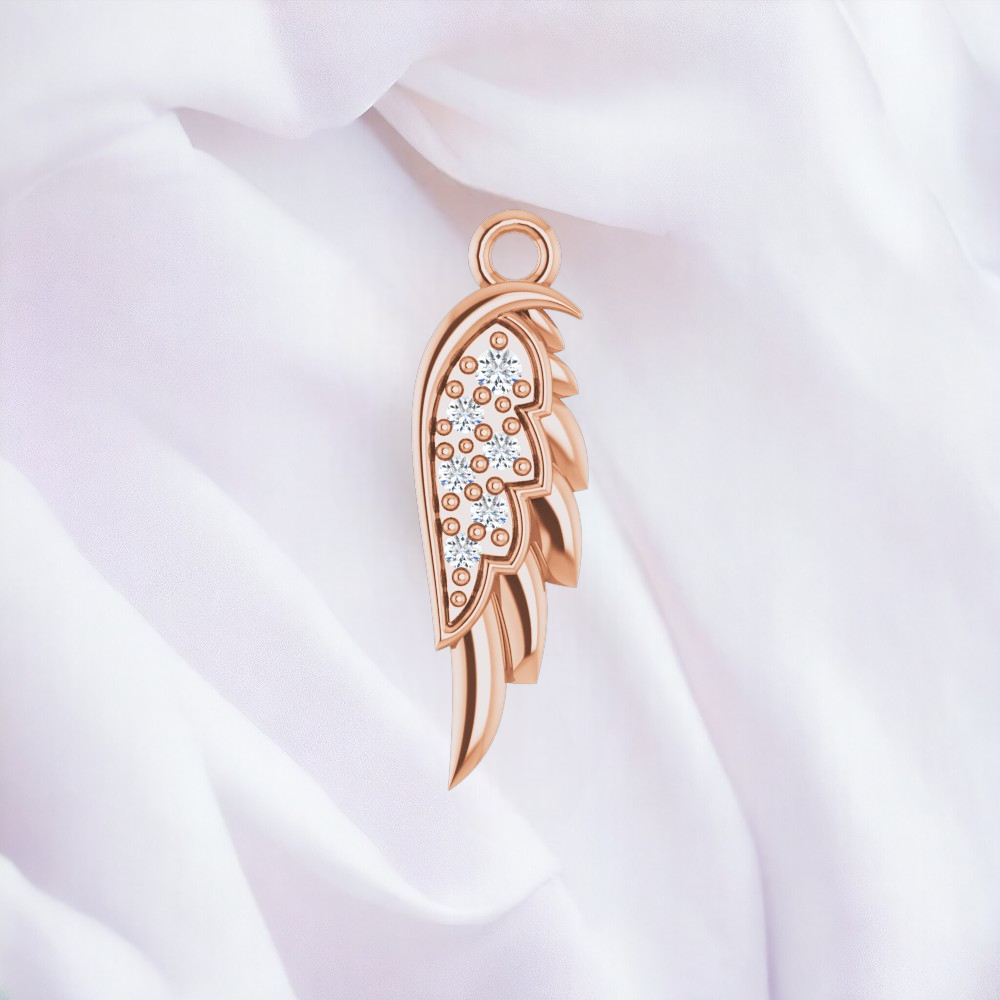 Elegant 14k rose gold angel wing necklace with diamond accents, displayed against a white fabric backdrop.