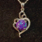 Video showcasing the Radiant Heart pendant with a sparkly purple crushed opal cremation stone in sterling silver, rotating to reveal all angles, highlighting the pendant's luminous beauty and heartfelt significance.