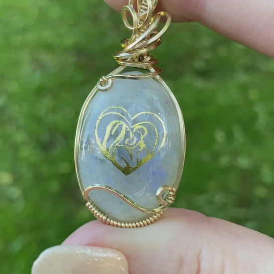 Video of Mother of an Angel necklace with views of both front and back designs.