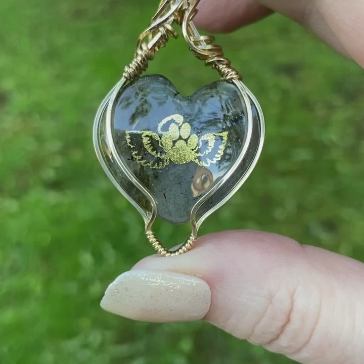 Video showcasing the front and back of the angel paws necklace, perfect for remembering your furry angel.