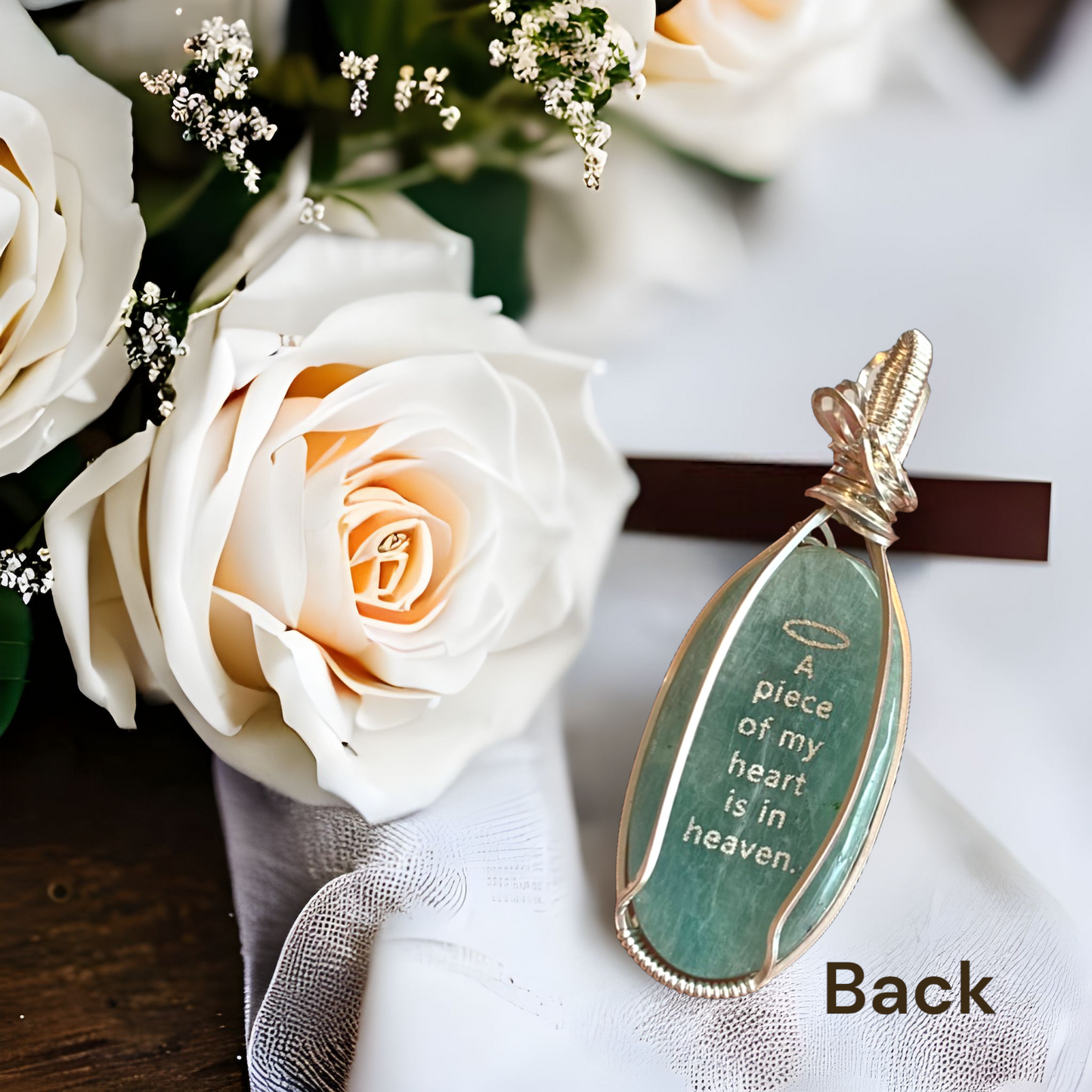 Sterling Silver floral cross necklace with a seafoam blue-green Amazonite gemstone, cross design on front, and quote on back: "A piece of my heart is in heaven."